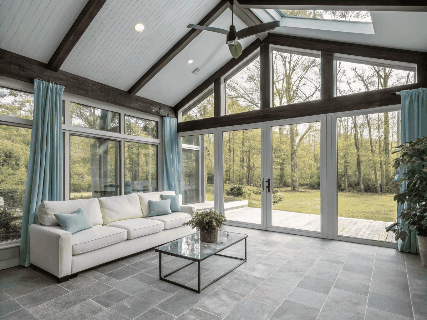 Large unobstructed picture window framing scenic green outdoor landscape