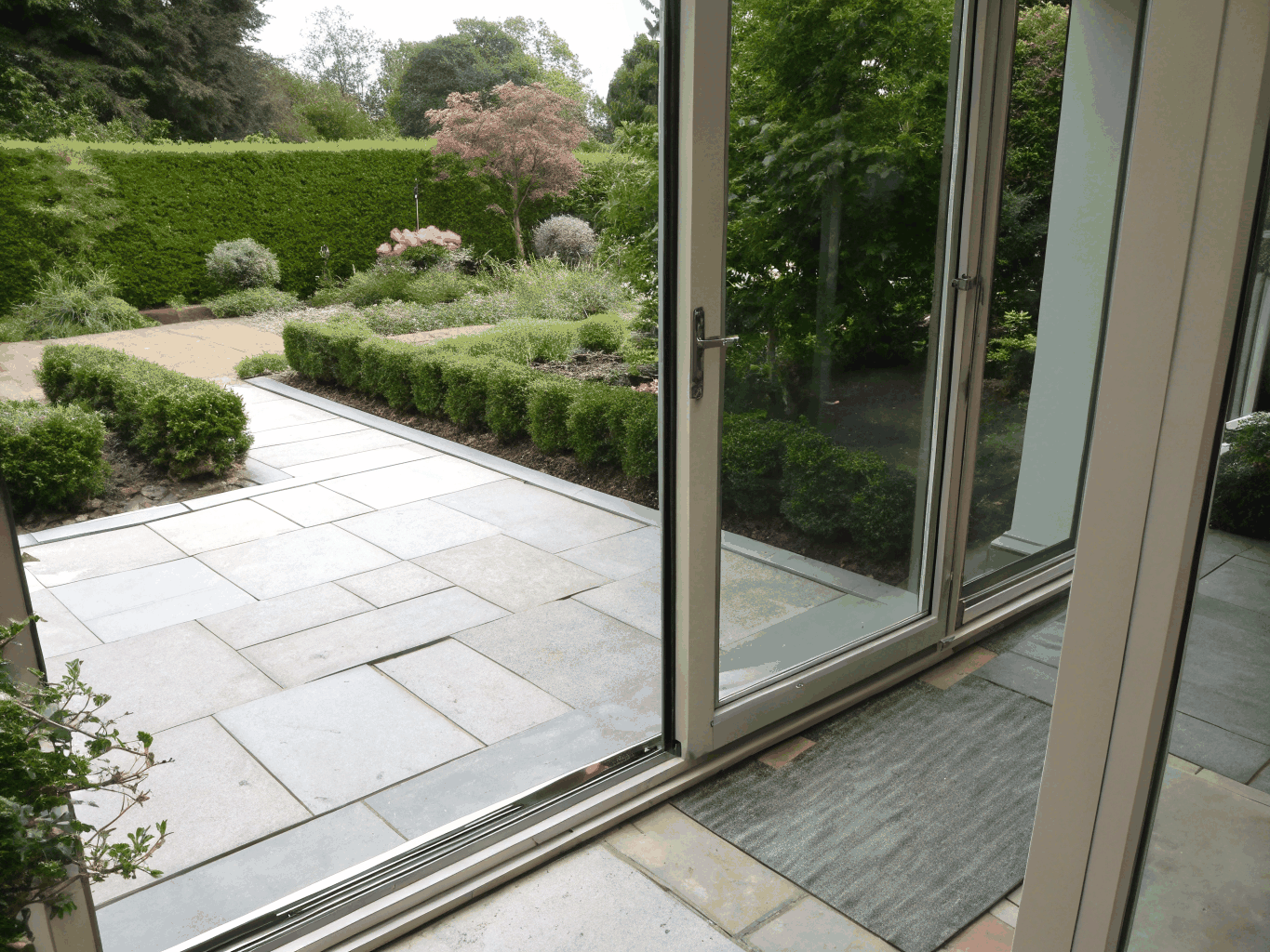 JELD-WEN contemporary sliding patio door system leading to backyard patio