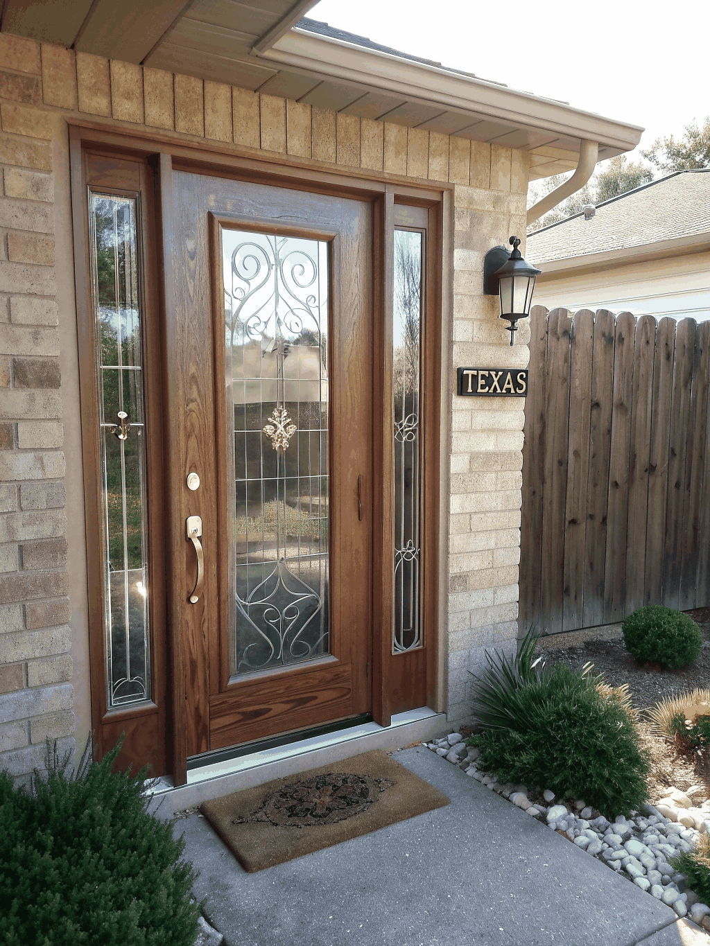 Contemporary glass patio doors installed overlooking an outdoor living space in McKinney Texas